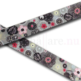 Dekorband 22 mm, med rosa och svarta blommor på grått band.