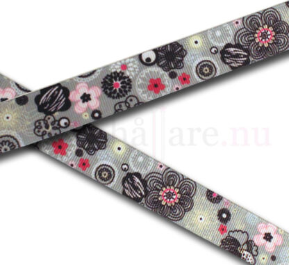 Dekorband 22 mm, med rosa och svarta blommor på grått band.